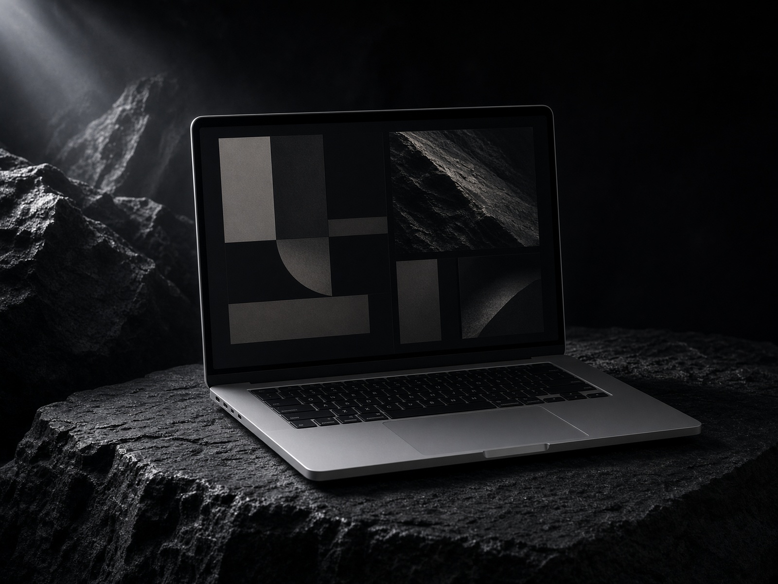 An open laptop on a dark desk